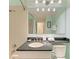 Classic bathroom features single vanity with granite counter, tub, and ample lighting at 511 Loquat Dr, Anna Maria, FL 34216