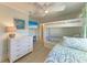 Charming bedroom features bunk beds, beachy decor, and ample natural light at 511 Loquat Dr, Anna Maria, FL 34216