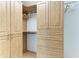 Walk-in closet with custom wood shelving and drawers, offering ample storage space at 511 Loquat Dr, Anna Maria, FL 34216