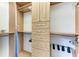 Spacious closet with wood cabinetry and drawers providing ample storage solutions at 511 Loquat Dr, Anna Maria, FL 34216