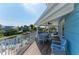 Spacious covered deck overlooking the waterway and offering ample seating at 511 Loquat Dr, Anna Maria, FL 34216