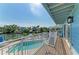 Scenic deck view with private pool and waterfront access perfect for outdoor relaxation at 511 Loquat Dr, Anna Maria, FL 34216