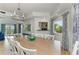 Dining room featuring tray ceilings, picture windows, and seating for ten at 511 Loquat Dr, Anna Maria, FL 34216