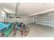 Spacious garage with epoxy flooring, kayak, bikes and ample storage at 511 Loquat Dr, Anna Maria, FL 34216