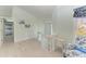 Hallway with white wood floors leading to a bedroom with bunkbeds at 511 Loquat Dr, Anna Maria, FL 34216