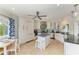 Bright kitchen with white cabinetry, stainless appliances, and island at 511 Loquat Dr, Anna Maria, FL 34216