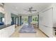 View of kitchen with island and breakfast area overlooking a backyard canal at 511 Loquat Dr, Anna Maria, FL 34216