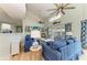 Bright living room with sofas, high ceilings, and view to the outside at 511 Loquat Dr, Anna Maria, FL 34216