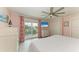 Light filled main bedroom features balcony access and water views at 511 Loquat Dr, Anna Maria, FL 34216