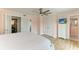 Inviting main bedroom with hardwood floors, soft lighting, and access to ensuite bath at 511 Loquat Dr, Anna Maria, FL 34216