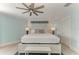 Stylishly appointed main bedroom with soft colors and a coastal design at 511 Loquat Dr, Anna Maria, FL 34216