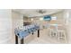 Recreation room with seating, foosball, and ping pong tables at 511 Loquat Dr, Anna Maria, FL 34216