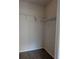 Walk-in closet featuring wire shelving and wood-look floors at 5168 Northridge Rd # 102, Sarasota, FL 34238