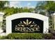 Elegant community sign surrounded by lush landscaping welcomes you to Serenade on Palmer Ranch at 5168 Northridge Rd # 102, Sarasota, FL 34238