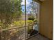 Inviting screened porch offers a serene view of the lush backyard, perfect for relaxing and entertaining at 5168 Northridge Rd # 102, Sarasota, FL 34238