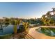 Aerial view of the pool and waterfront showing dock, lush landscaping and surrounding community at 520 Harbor Cay Dr, Longboat Key, FL 34228