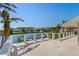 Expansive balcony boasts waterfront views, offering a serene spot for outdoor relaxation and entertainment at 520 Harbor Cay Dr, Longboat Key, FL 34228