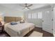 Bedroom with dark wood floor and white shutters for ample sunlight at 520 Harbor Cay Dr, Longboat Key, FL 34228
