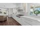 Bright kitchen features white cabinetry and countertops, with stainless steel appliances at 520 Harbor Cay Dr, Longboat Key, FL 34228