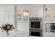 Kitchen with stainless steel appliances, glass front cabinets, and decor at 520 Harbor Cay Dr, Longboat Key, FL 34228