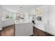 Large white kitchen with island and stainless steel appliances at 520 Harbor Cay Dr, Longboat Key, FL 34228