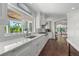 Bright kitchen with stainless steel appliances and a view of the backyard at 520 Harbor Cay Dr, Longboat Key, FL 34228