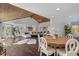Spacious living room and dining area with an open layout, wood floors, and plenty of natural light at 520 Harbor Cay Dr, Longboat Key, FL 34228