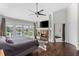 Spacious main bedroom has a fireplace, waterfront views, and a door to the main bathroom at 520 Harbor Cay Dr, Longboat Key, FL 34228