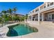 Beautiful pool area complemented by the home's elegant architecture and lush tropical landscaping at 520 Harbor Cay Dr, Longboat Key, FL 34228