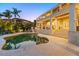 Evening view of the pool area, reflecting the home's design and complemented by tropical landscaping at 520 Harbor Cay Dr, Longboat Key, FL 34228