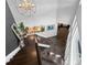 Grand foyer with a stunning staircase, chandelier, and views of the dining area, offering a luxurious entry at 520 Harbor Cay Dr, Longboat Key, FL 34228