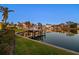 Scenic waterfront view showcasing a private boat lift and beautiful homes along the canal at 520 Harbor Cay Dr, Longboat Key, FL 34228