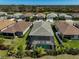 Aerial view of the house, showcasing the pool and well-manicured backyard at 5750 Long Shore Loop, Sarasota, FL 34238