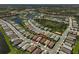 Community aerial view showcases the property's location near water and green spaces at 5750 Long Shore Loop, Sarasota, FL 34238