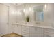 Bright bathroom with double sinks, modern fixtures, and quartz counters at 6136 Hollywood Blvd, Sarasota, FL 34231