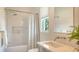 Well-lit bathroom with a combined shower and tub featuring stylish fixtures at 6136 Hollywood Blvd, Sarasota, FL 34231