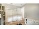 Neutral bedroom featuring closet and dresser with wood-look tile flooring at 6136 Hollywood Blvd, Sarasota, FL 34231