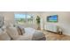 Spacious bedroom with modern decor and large windows overlooking waterfront at 6136 Hollywood Blvd, Sarasota, FL 34231