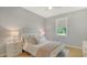 Cozy bedroom with a plush bed, soft lighting, and a serene atmosphere at 6136 Hollywood Blvd, Sarasota, FL 34231