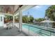 Covered lanai featuring dining with canal view at 6136 Hollywood Blvd, Sarasota, FL 34231