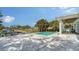 Inviting pool and patio area with scenic views of lush tropical foliage and serene canal at 6136 Hollywood Blvd, Sarasota, FL 34231