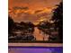 Beautiful sunset view over canal and boats, creating a tranquil and picturesque waterfront scene at 6136 Hollywood Blvd, Sarasota, FL 34231