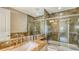 Contemporary bathroom with a tiled shower/tub and a sleek vanity at 650 Golden Gate Pt # 602, Sarasota, FL 34236