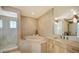 Luxurious bathroom with a large tub, separate shower, and vanity with ample storage at 650 Golden Gate Pt # 602, Sarasota, FL 34236