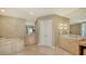 Spacious bathroom with a soaking tub, dual vanities, and elegant tile flooring at 650 Golden Gate Pt # 602, Sarasota, FL 34236