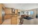 Bright kitchen with modern appliances, a center island, and an adjacent dining area at 650 Golden Gate Pt # 602, Sarasota, FL 34236