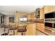 Well-appointed kitchen with stainless steel appliances, granite countertops, and a breakfast bar at 650 Golden Gate Pt # 602, Sarasota, FL 34236