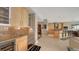 Open-concept kitchen and living space featuring stainless steel appliances and sleek cabinetry at 650 Golden Gate Pt # 602, Sarasota, FL 34236