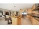 Open kitchen features granite countertops, stainless appliances, and a spacious island with bar seating at 650 Golden Gate Pt # 602, Sarasota, FL 34236