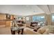 Spacious open floorplan with views, hardwood floors, modern kitchen, and dining area at 650 Golden Gate Pt # 602, Sarasota, FL 34236